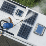 Man pressure washing solar panels on RV